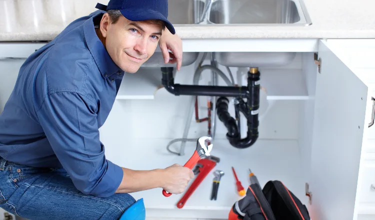 a plumber technician with a tool belt from TMK Plumber Austin in Austin, TX - Slab leak detection